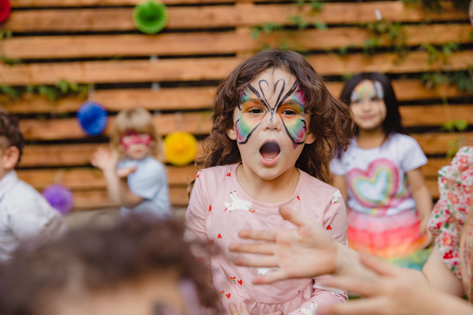 Happy kids with colourful face paint
